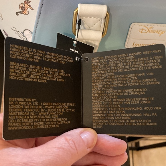 Ariel, sitting under moon satchel, lounge, fly purse - Picture 6 of 11